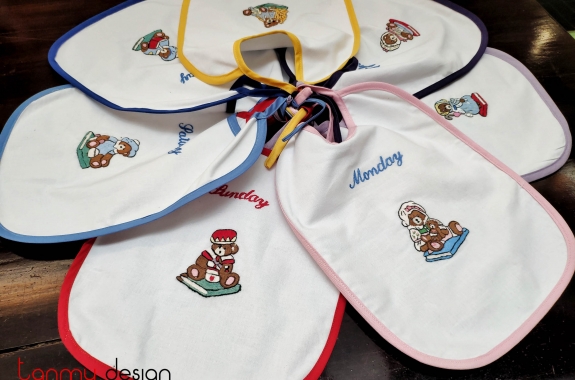 Set of 7 English embroidered baby bibs
